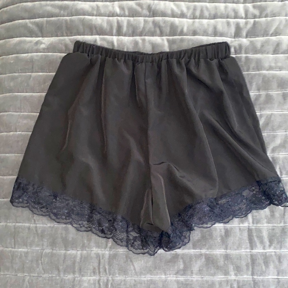 Never worn! High waist black satin material dressy shorts with lace at bottom!!